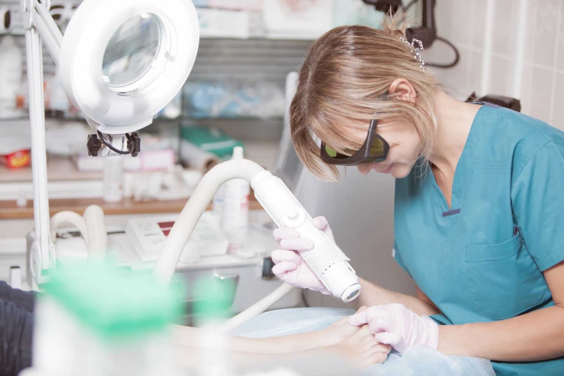A podiatrist providing bed bound foot care to a patient in Brevard County